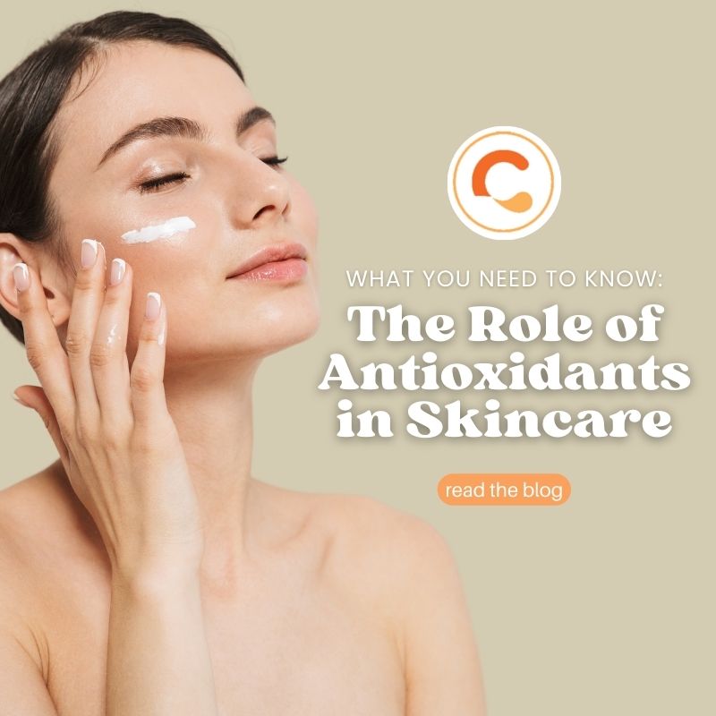 Woman applying cream to her cheek with her eyes closed, illustrating antioxidant skincare