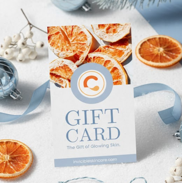 Gift card with decorative oranges and ribbons on a white background